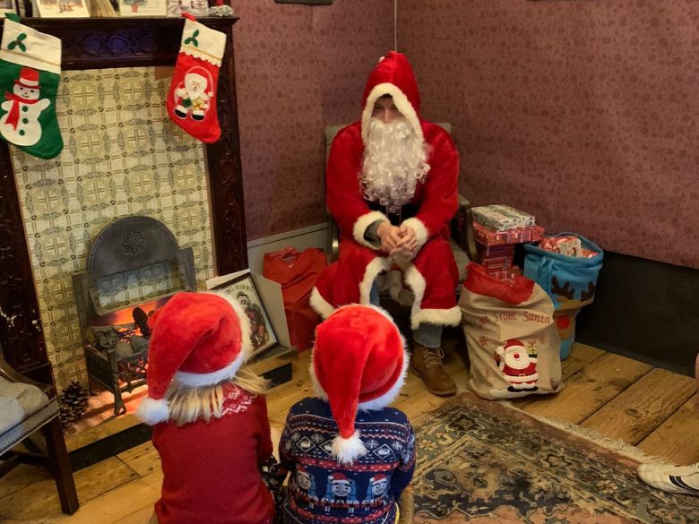 Children talk to Santa